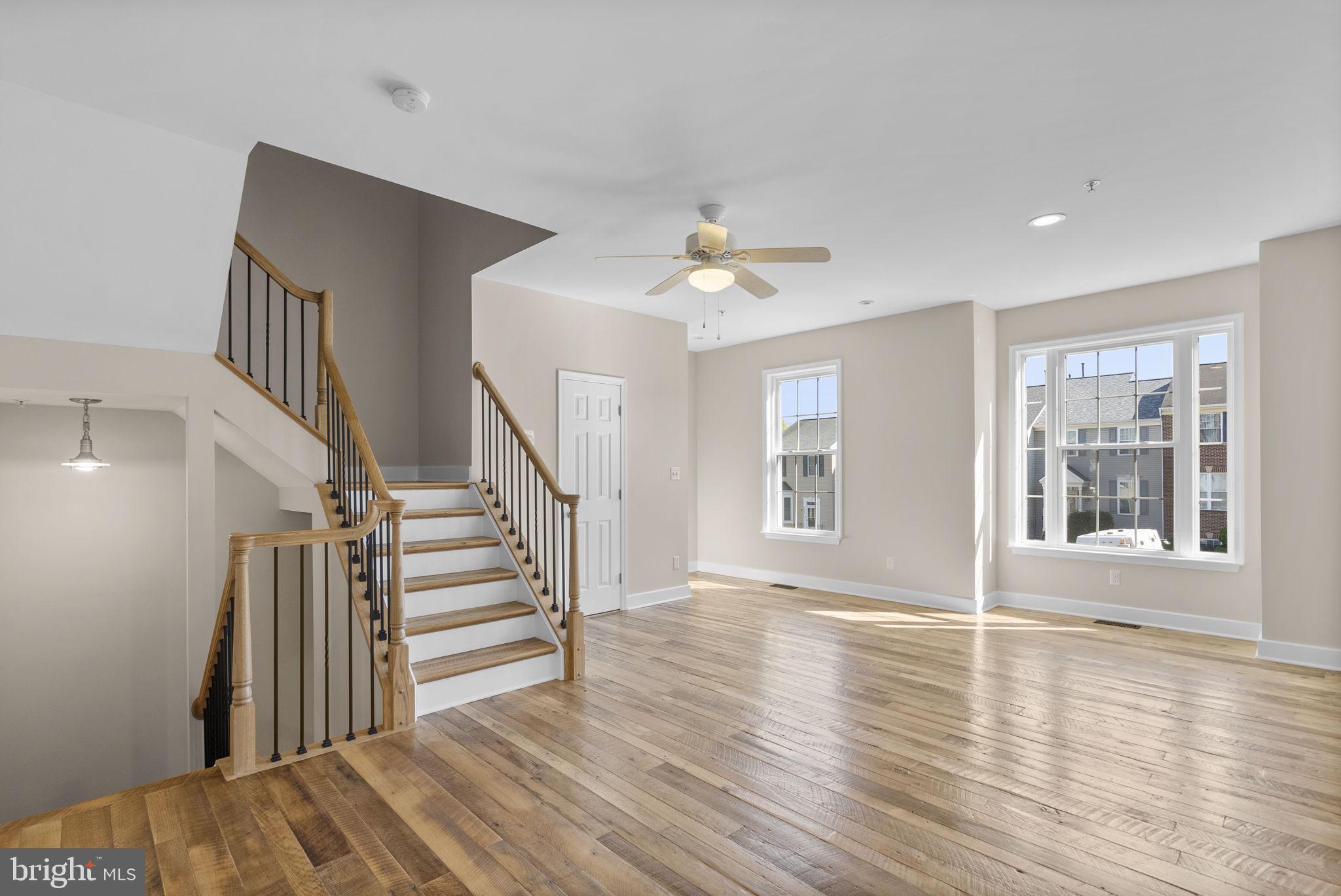 1304 Hill Born Drive Hanover, MD 21076 - Photo 4 of 47 a view of an empty room with wooden floor and a window