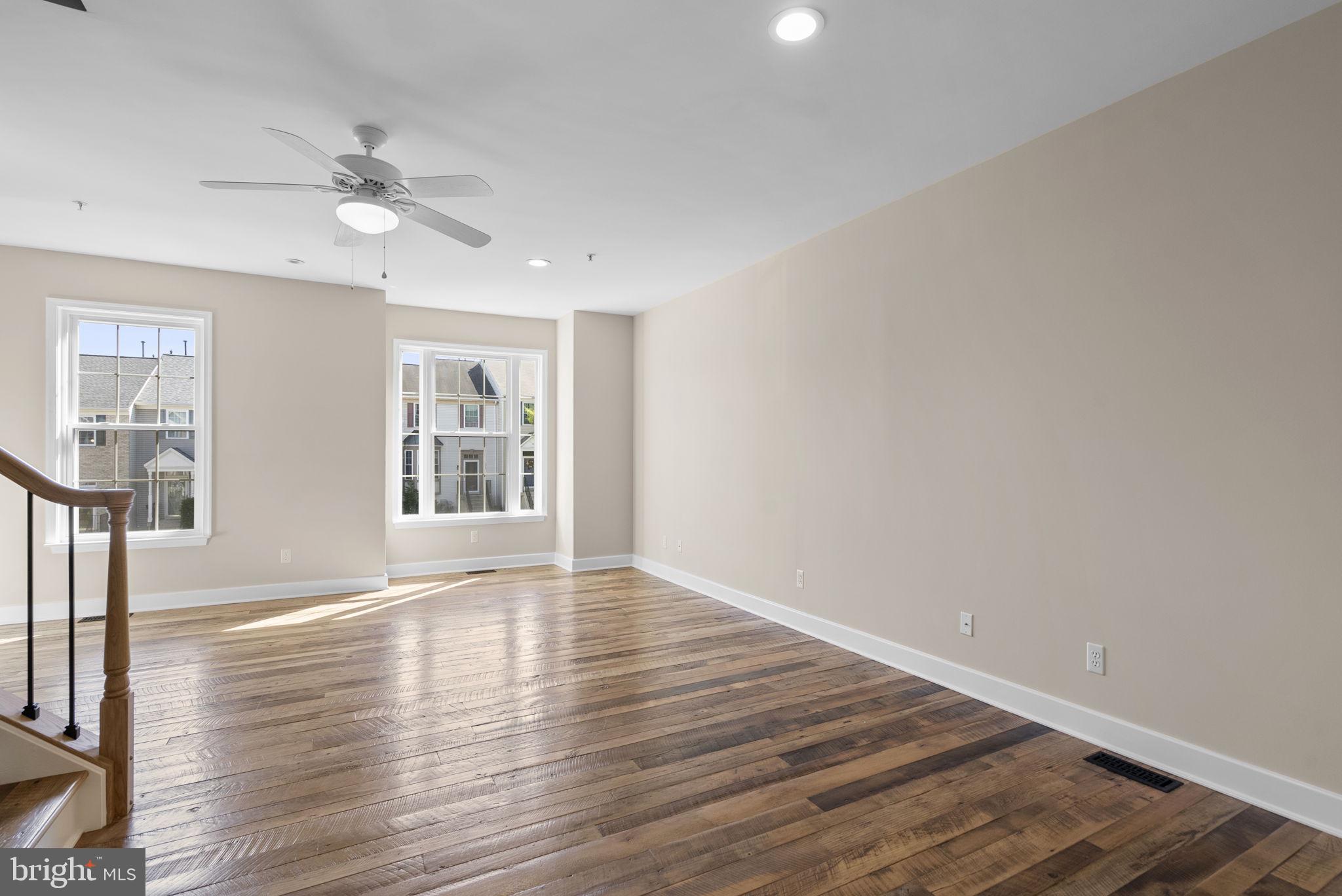 1304 Hill Born Drive Hanover, MD 21076 - Photo 6 of 47 a view of an empty room with wooden floor and a window