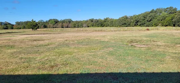 a view of an outdoor space and a yard