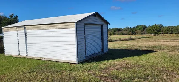 a view of a backyard of the house