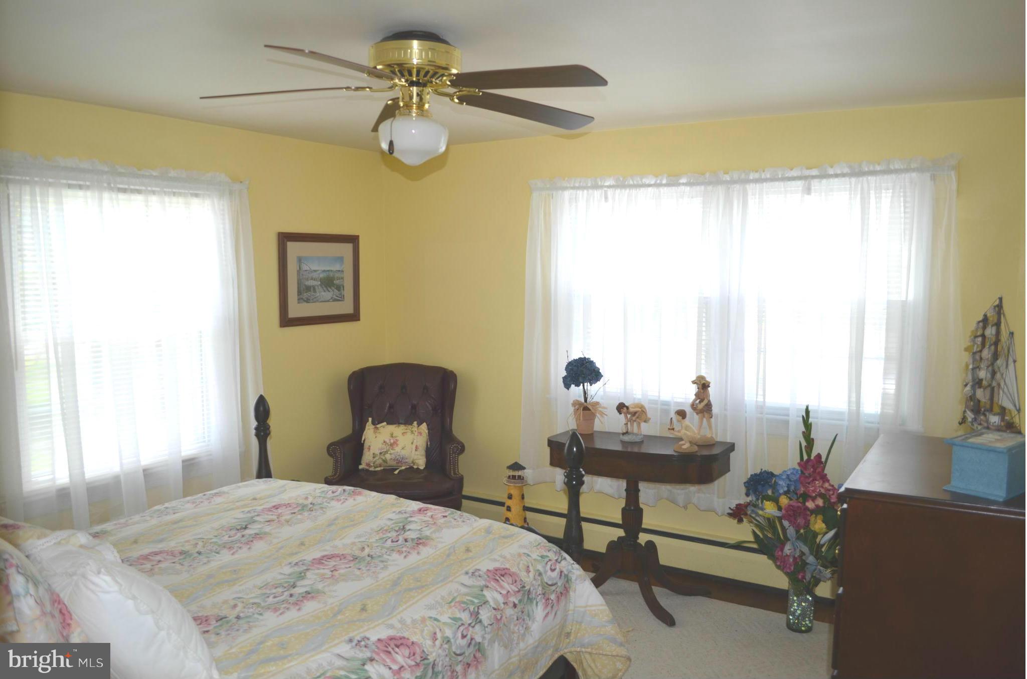 38320 Point Breeze Road Coltons Point, MD 20626 - Photo 11 of 13 a bedroom with a bed and a chair