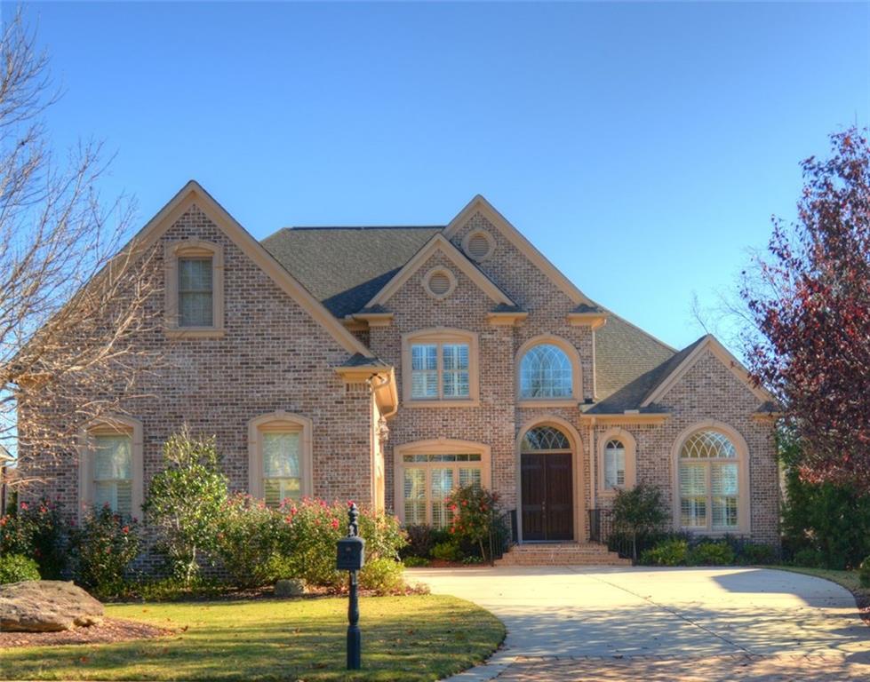Stunning 4 sided brick home on a gorgeous golf course lot!  Features the master suite & a secondary bedroom & bath on the main level!  Many upgrades throughout including extensive trim & crown molding!