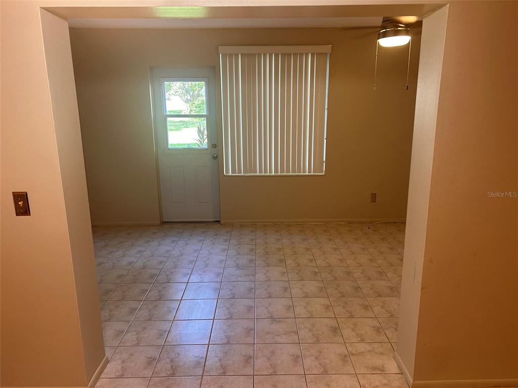 2402 Ecuadorian Way, Unit 18 Clearwater, FL 33763 - Photo 11 of 55 a view of an empty room with a window