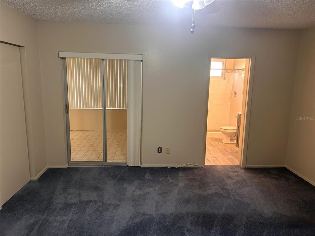 2402 Ecuadorian Way, Unit 18 Clearwater, FL 33763 - Photo 18 of 55 an empty room with windows