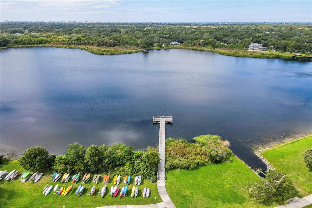 2402 Ecuadorian Way, Unit 18 Clearwater, FL 33763 - Photo 39 of 54 a view of a lake with a mountain in the background