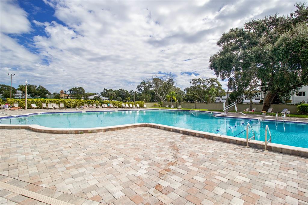 2402 Ecuadorian Way, Unit 18 Clearwater, FL 33763 - Photo 48 of 54 a view of building with river and trees in the background