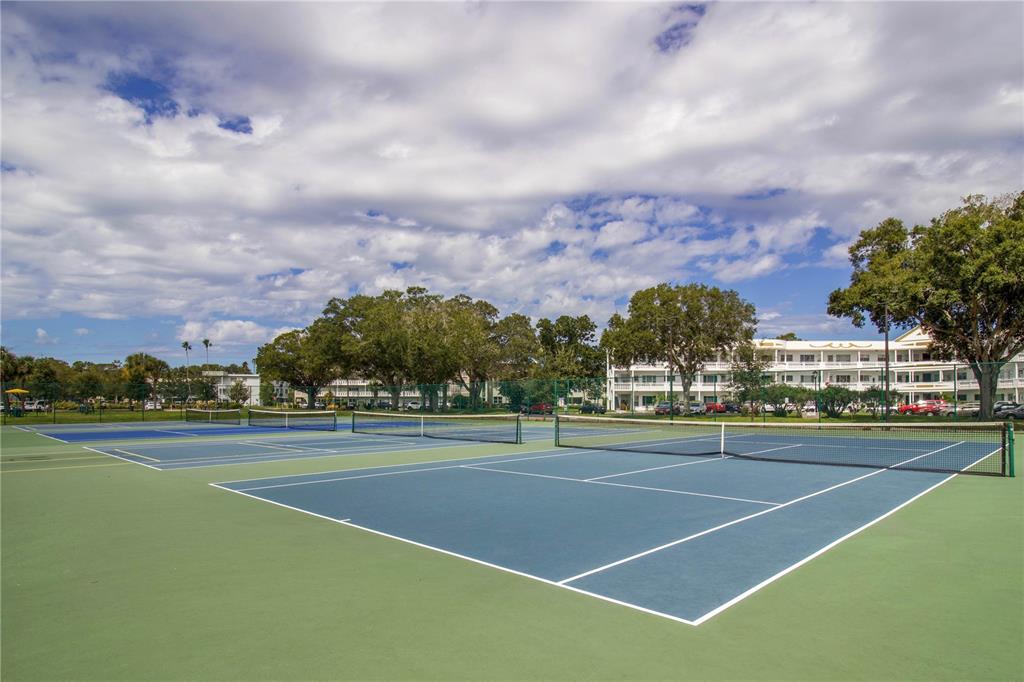 2402 Ecuadorian Way, Unit 18 Clearwater, FL 33763 - Photo 50 of 54 a view of a tennis court