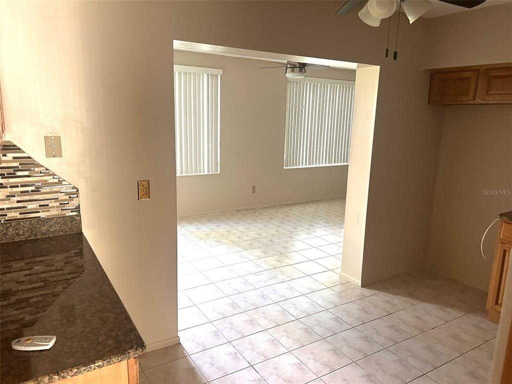 2402 Ecuadorian Way, Unit 18 Clearwater, FL 33763 - Photo 7 of 55 a view of an empty room with a window