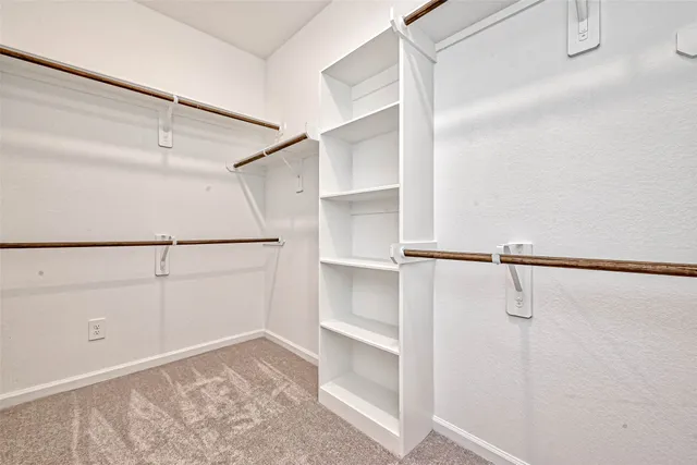 a view of an empty walk in closet