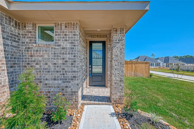 a front view of a house with yard