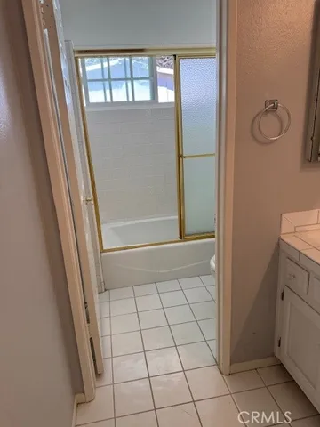 view of bathroom with bathtub and window