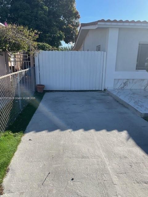 Hialeah Acres Hialeah, FL 33012 - Photo 4 of 9 a view of backyard space and wooden fence