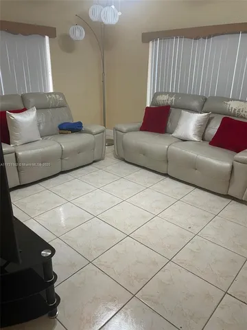 a living room with furniture and a couch