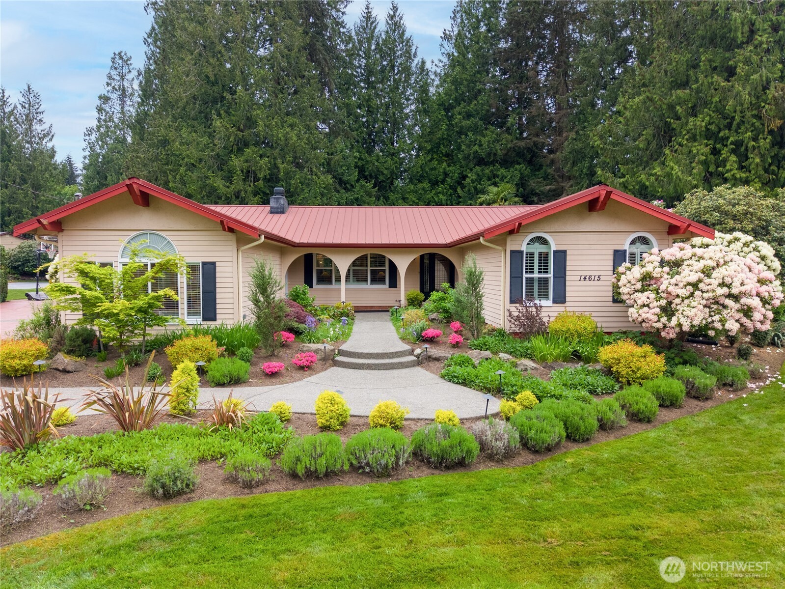 14615 205th Avenue Southeast Renton, WA 98059 - Photo 1 of 40 a front view of a house with a yard and potted plants