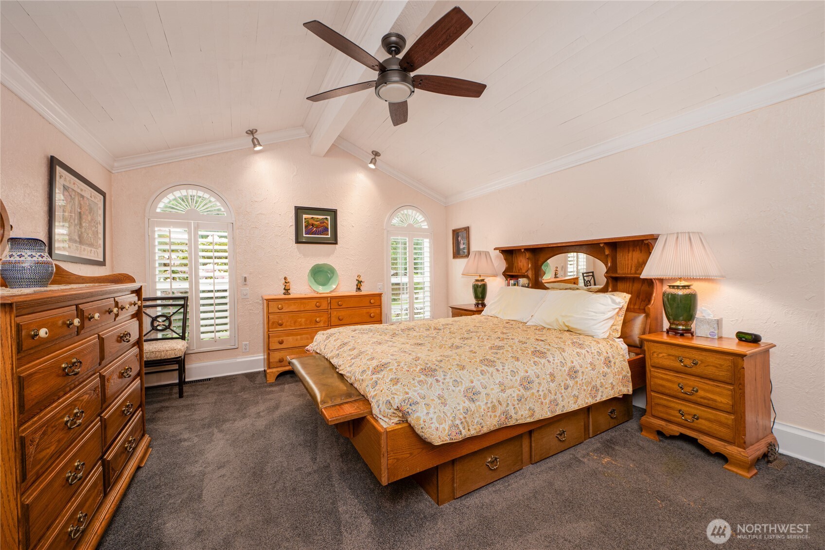14615 205th Avenue Southeast Renton, WA 98059 - Photo 13 of 40 a bedroom with a bed a dresser and a chandelier