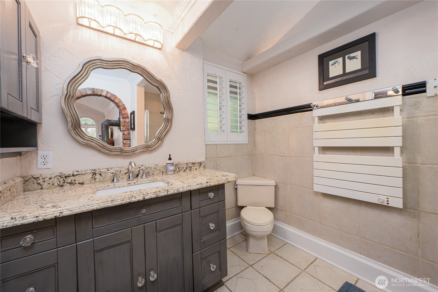 14615 205th Avenue Southeast Renton, WA 98059 - Photo 14 of 40 a bathroom with a toilet a sink and a mirror