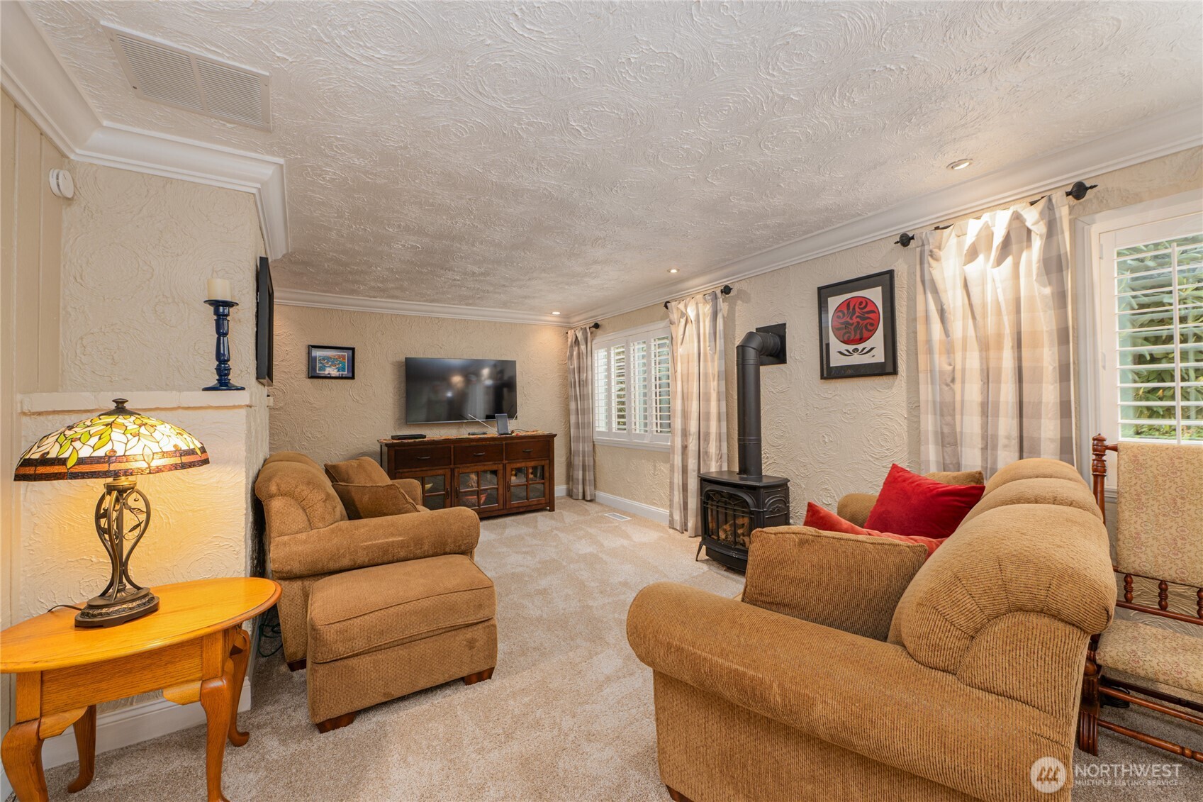 14615 205th Avenue Southeast Renton, WA 98059 - Photo 19 of 40 a living room with furniture and a flat screen tv