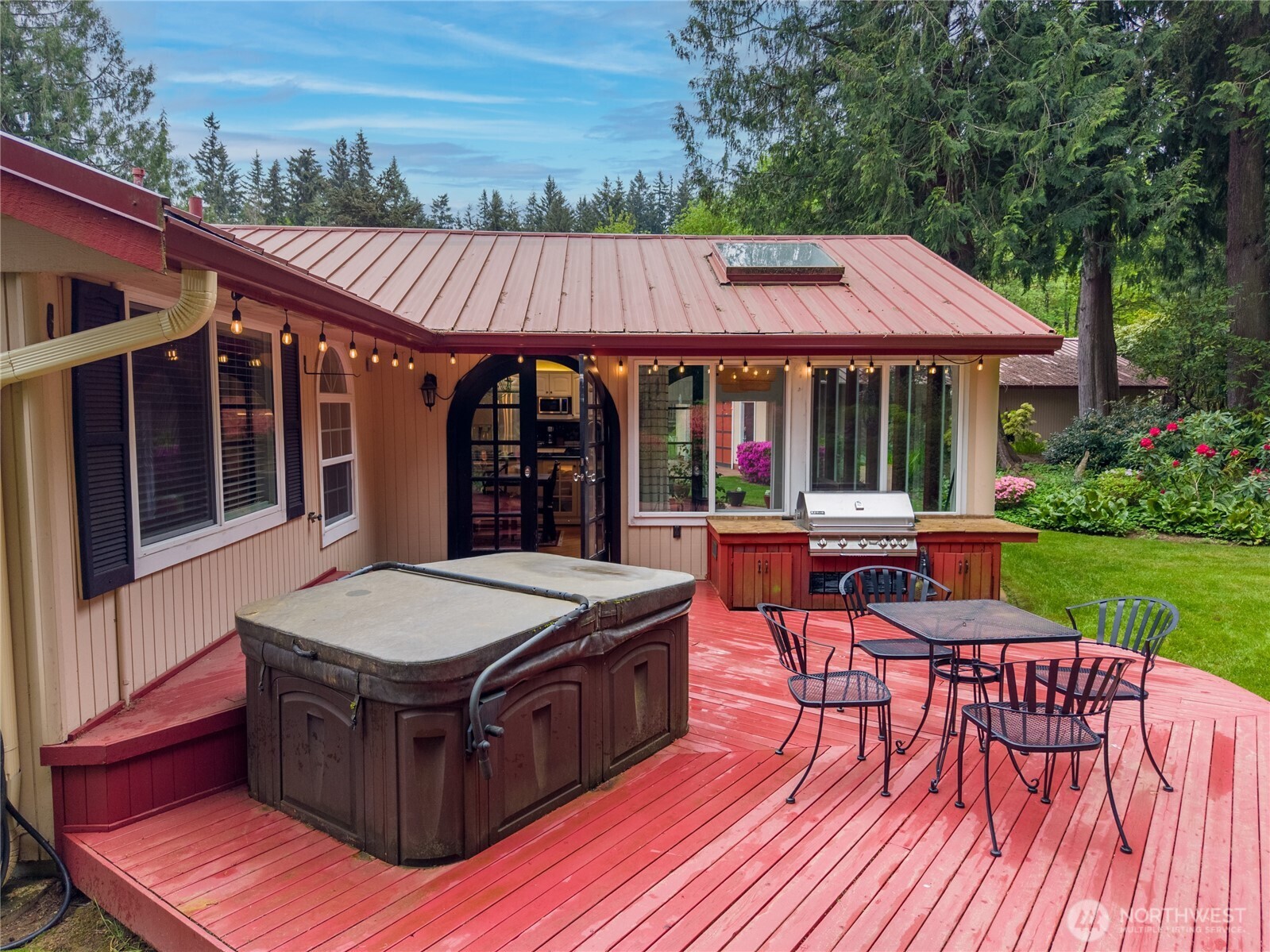 14615 205th Avenue Southeast Renton, WA 98059 - Photo 26 of 40 a view of a patio with table and chairs with wooden floor and fence