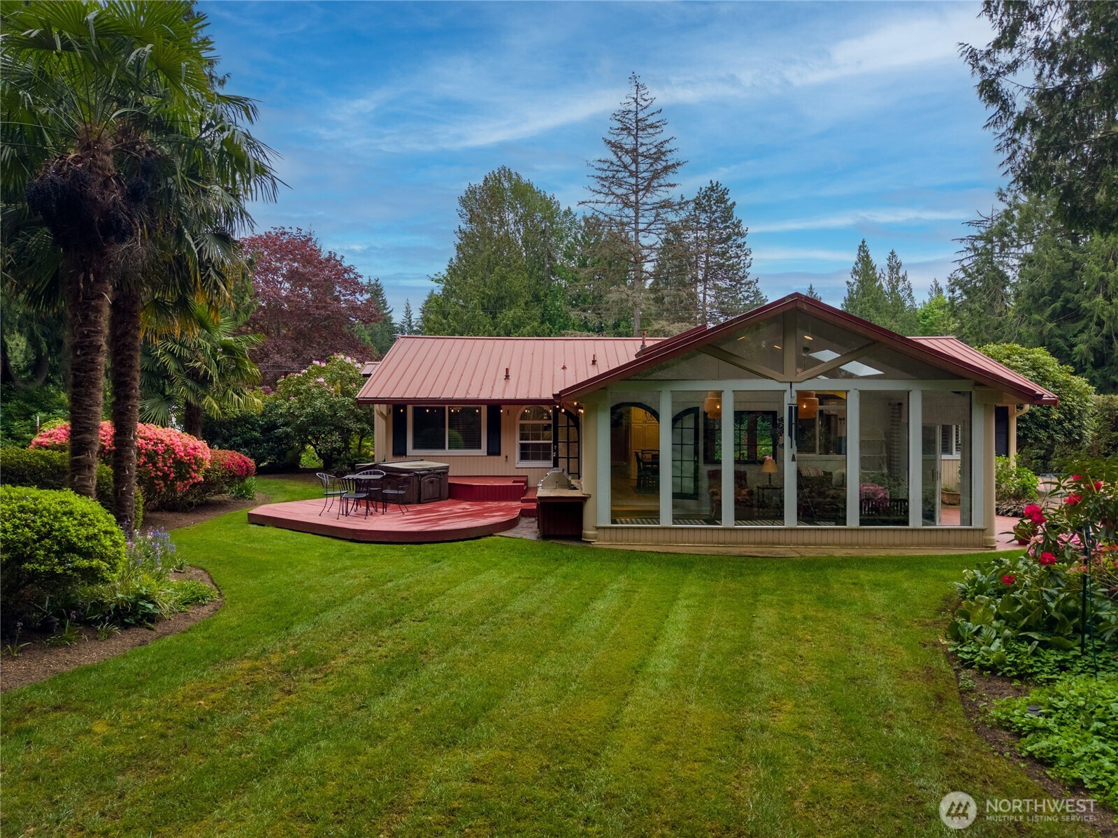14615 205th Avenue Southeast Renton, WA 98059 - Photo 29 of 40 a view of a house with garden and a swimming pool
