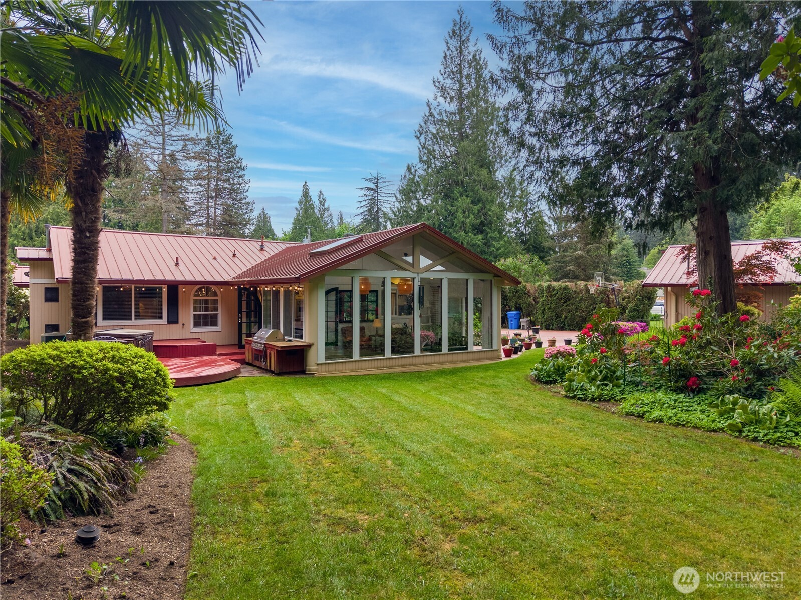 14615 205th Avenue Southeast Renton, WA 98059 - Photo 30 of 40 a front view of a house with garden and porch