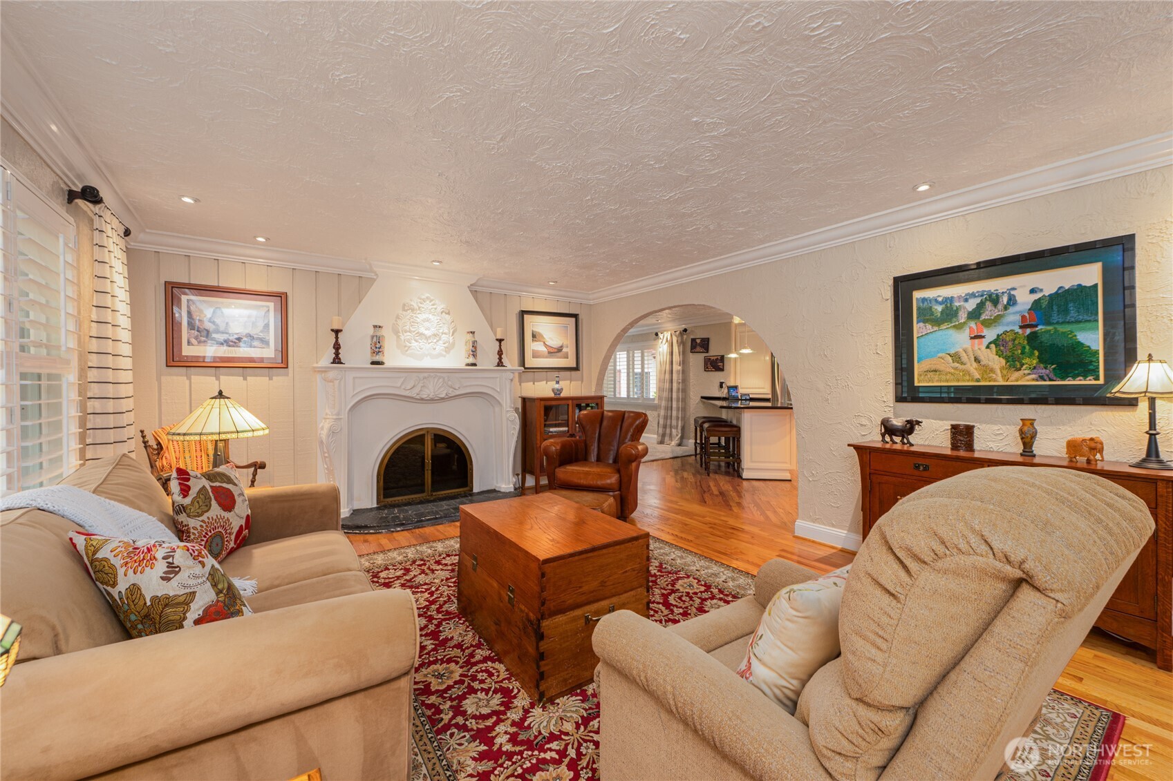 14615 205th Avenue Southeast Renton, WA 98059 - Photo 3 of 40 a living room with furniture two windows and a fireplace