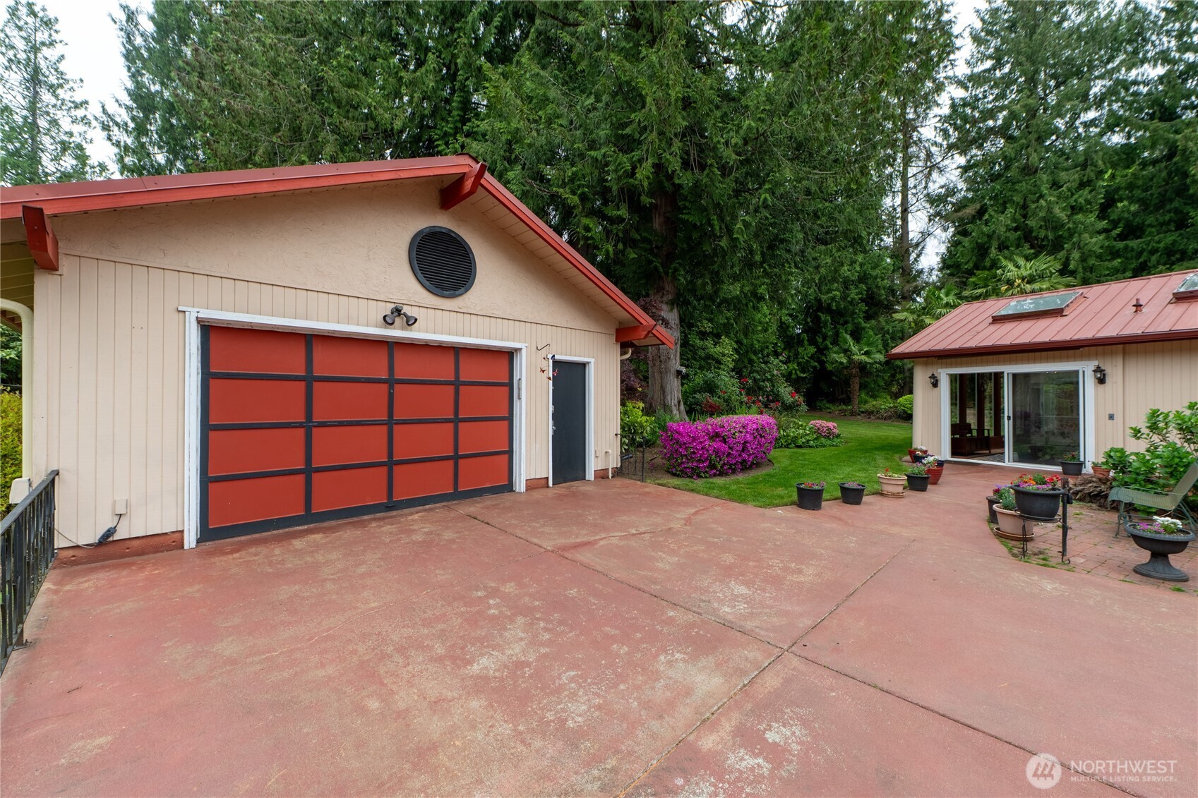 14615 205th Avenue Southeast Renton, WA 98059 - Photo 32 of 40 a view of a house with a yard and garage