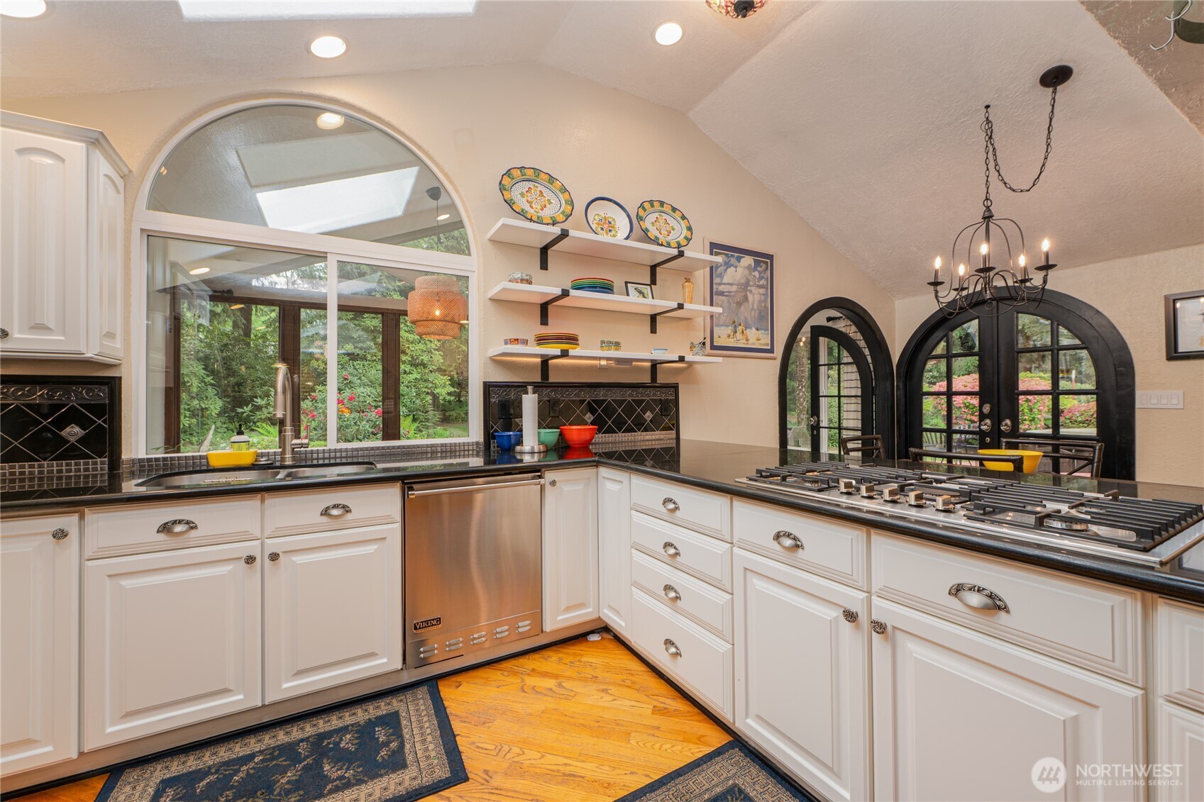 14615 205th Avenue Southeast Renton, WA 98059 - Photo 5 of 40 a kitchen with white cabinets and chandelier