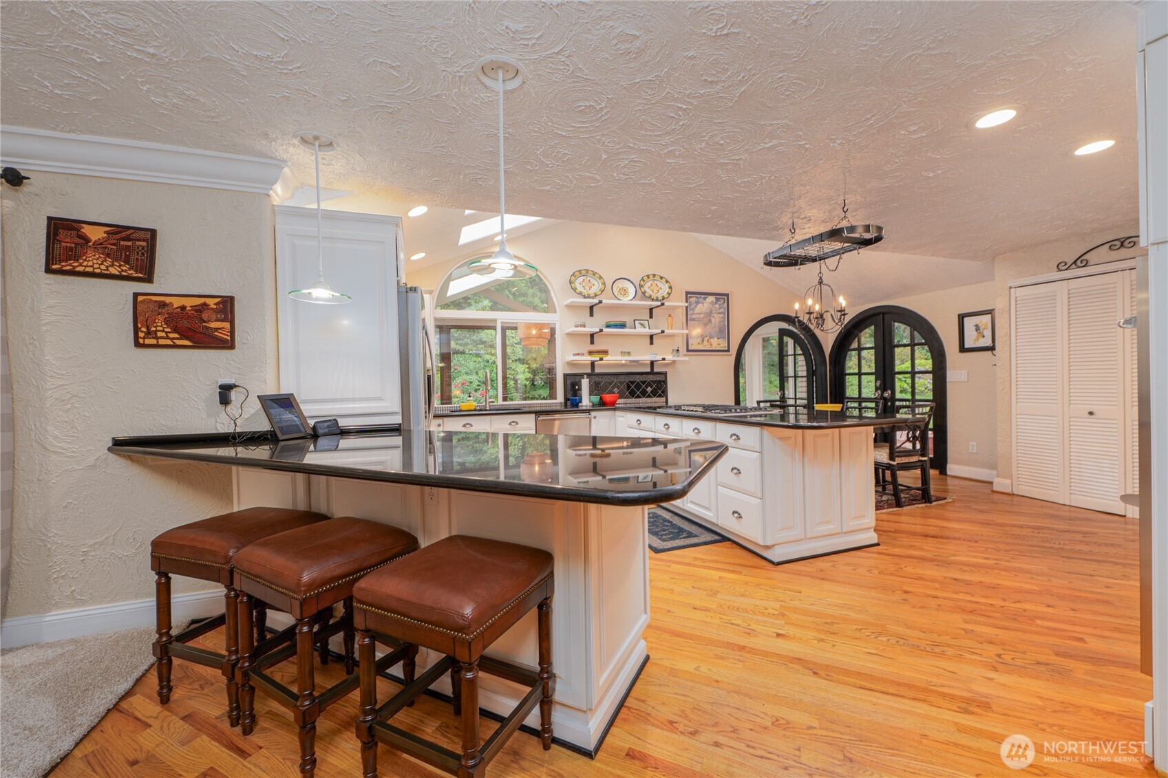 14615 205th Avenue Southeast Renton, WA 98059 - Photo 7 of 40 a view of a kitchen with a table and chairs