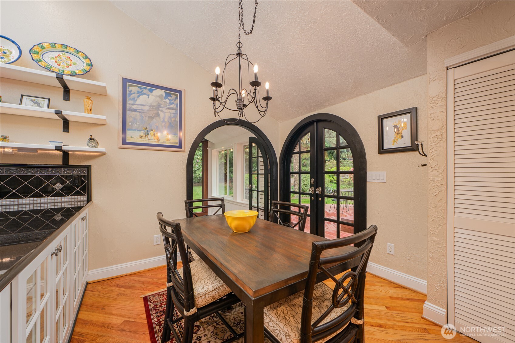 14615 205th Avenue Southeast Renton, WA 98059 - Photo 9 of 40 a view of a dining room with furniture and chandelier