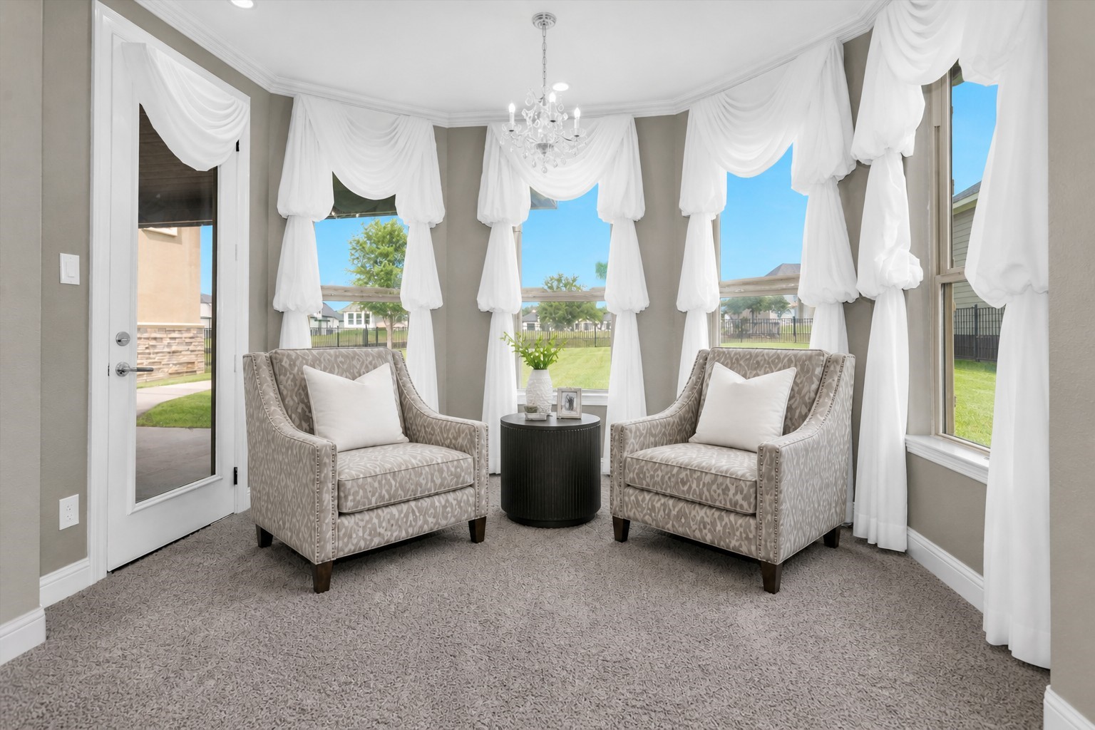 10887 Decatur Street Willis, TX 77318 - Photo 26 of 50 Light-filled retreat with multiple windows wrapping the room, bringing in great natural light and offering views of the backyard. The additional sitting area gives this suite a flexible layout that goes well beyond a standard bedroom.