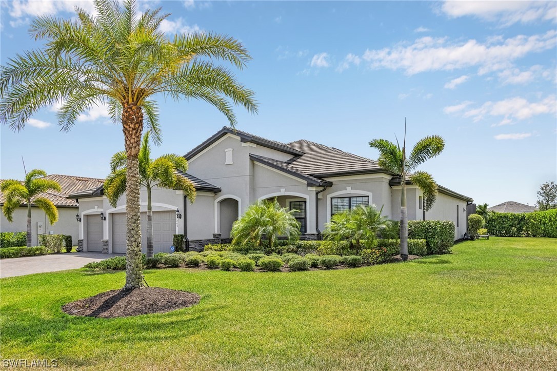 a front view of house with yard and green space