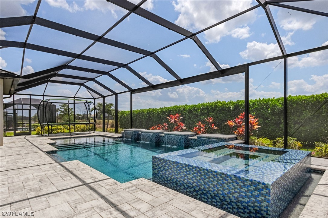 17405 Cabrini Way Estero, FL 33928 - Photo 15 of 34 a view of swimming pool with a patio