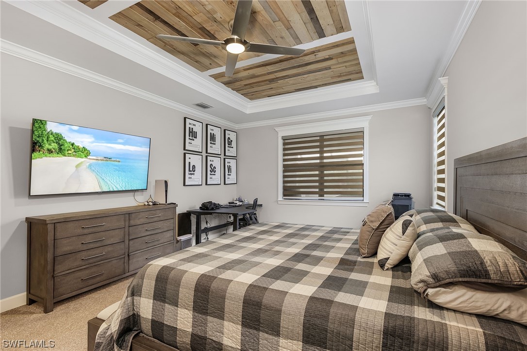17405 Cabrini Way Estero, FL 33928 - Photo 25 of 34 a bedroom with a bed and a flat screen tv