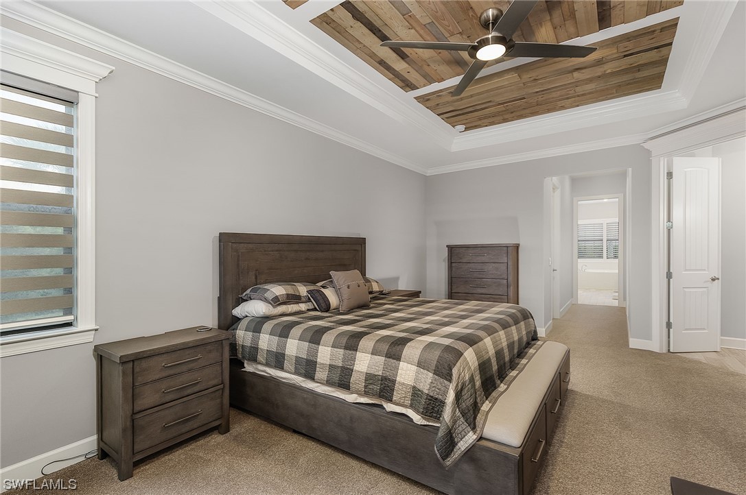 17405 Cabrini Way Estero, FL 33928 - Photo 26 of 34 a bedroom with a bed and a window