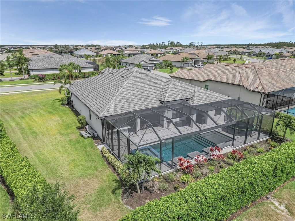17405 Cabrini Way Estero, FL 33928 - Photo 31 of 34 an aerial view of a house with a garden space