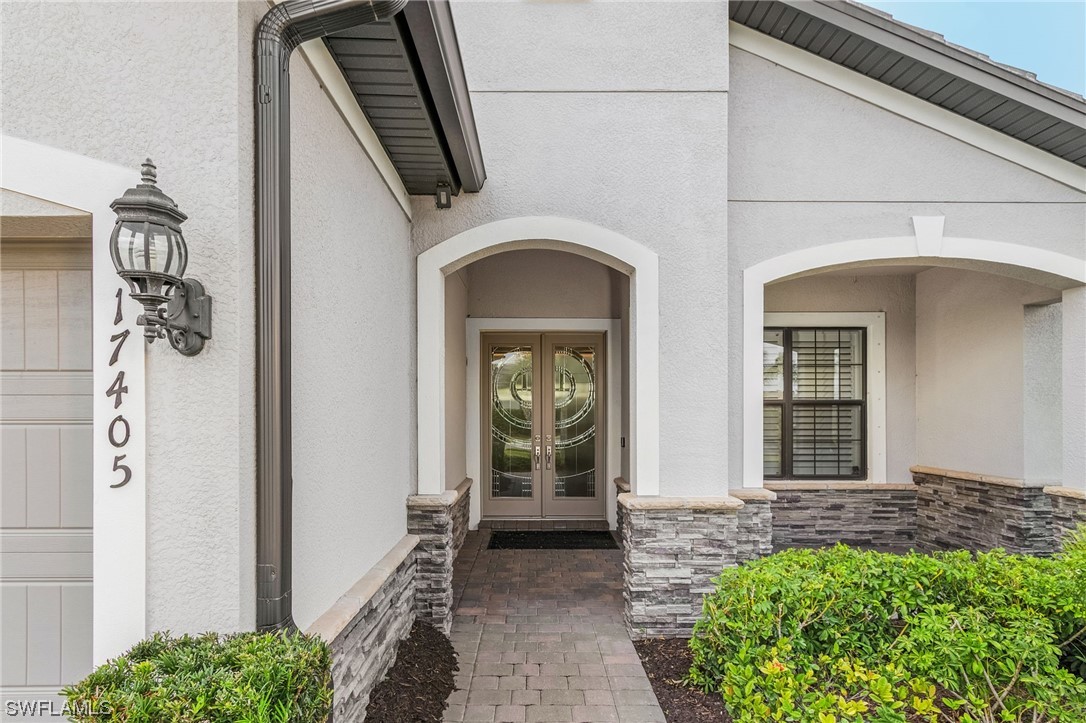 17405 Cabrini Way Estero, FL 33928 - Photo 4 of 34 a view of front door of house