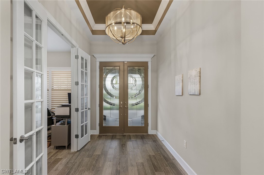 17405 Cabrini Way Estero, FL 33928 - Photo 5 of 34 a view of a livingroom with wooden floor and a window