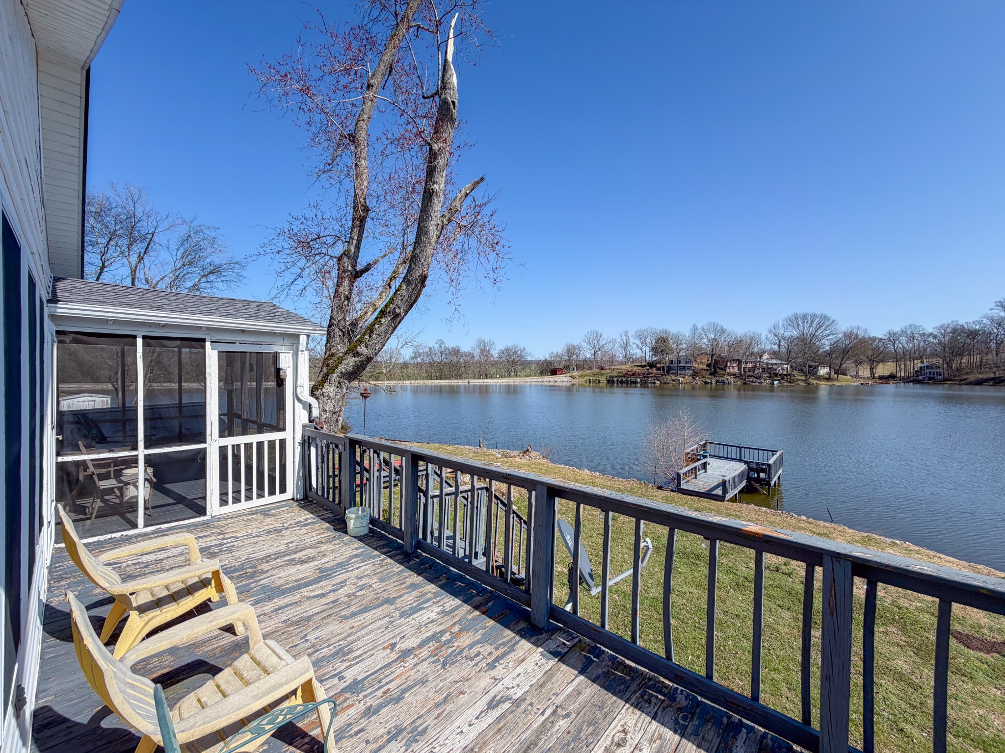 2701 Clear Creek Road Pulaski, TN 38478 - Photo 27 of 42 a view of a deck with two chair and wooden floor