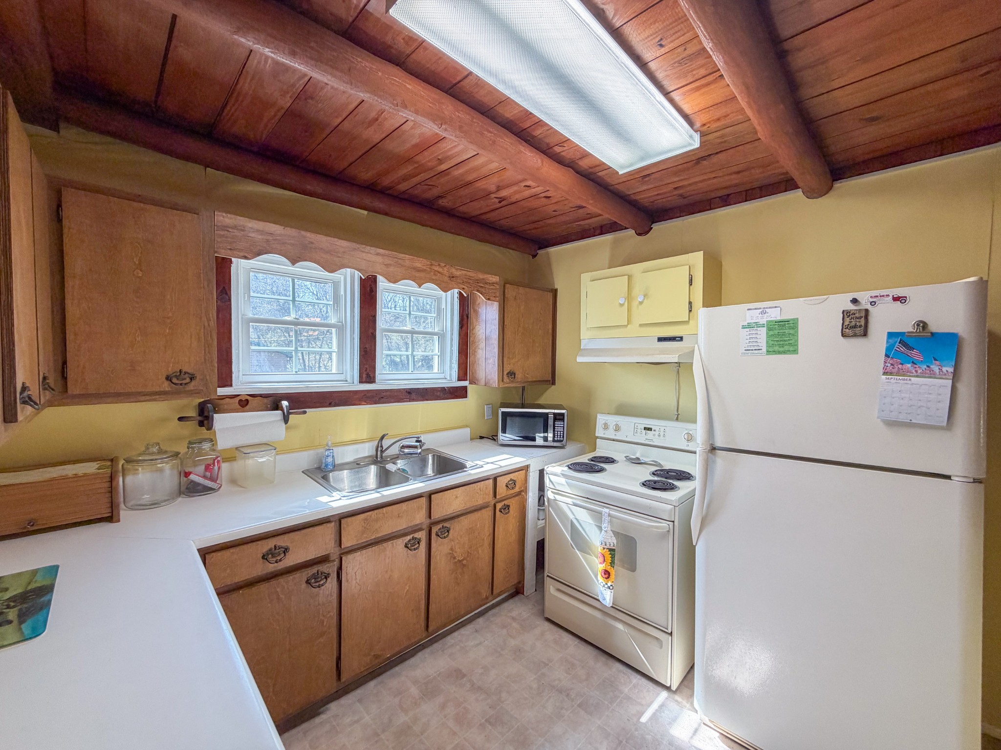 2701 Clear Creek Road Pulaski, TN 38478 - Photo 7 of 42 a kitchen with a sink a refrigerator and cabinets