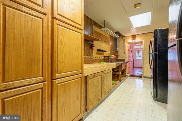a kitchen with stainless steel appliances a refrigerator and a stove
