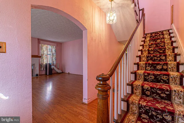 a view of entryway with wooden floor
