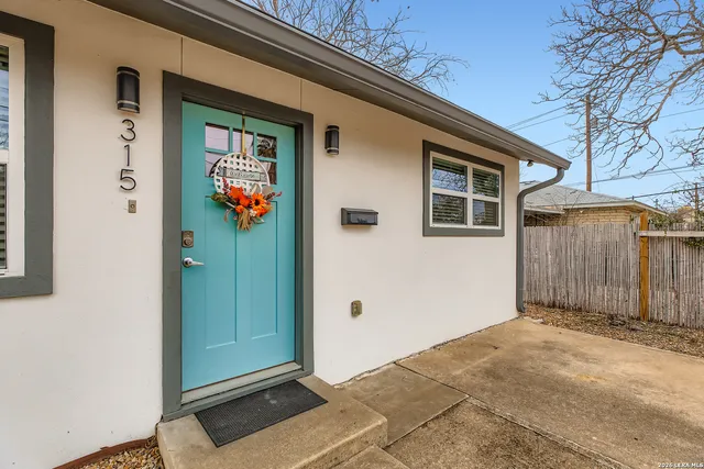 a front view of a house with a glass door
