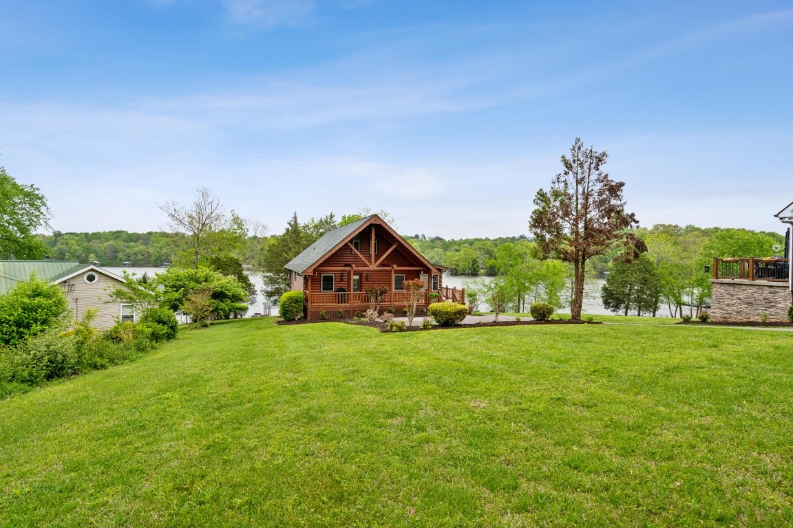 711 Pebble Point Road Lebanon, TN 37087 - Photo 5 of 13 a big house with a big yard and large trees