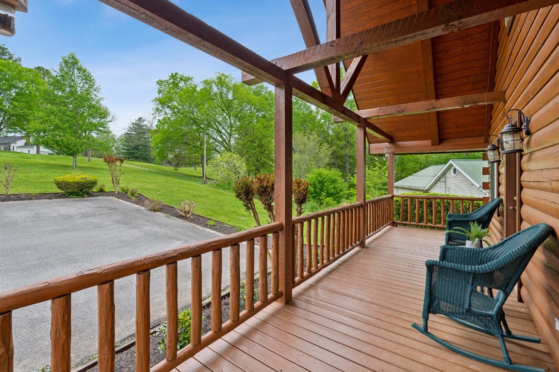 711 Pebble Point Road Lebanon, TN 37087 - Photo 6 of 13 a balcony with wooden floor outdoor seating and yard in the back