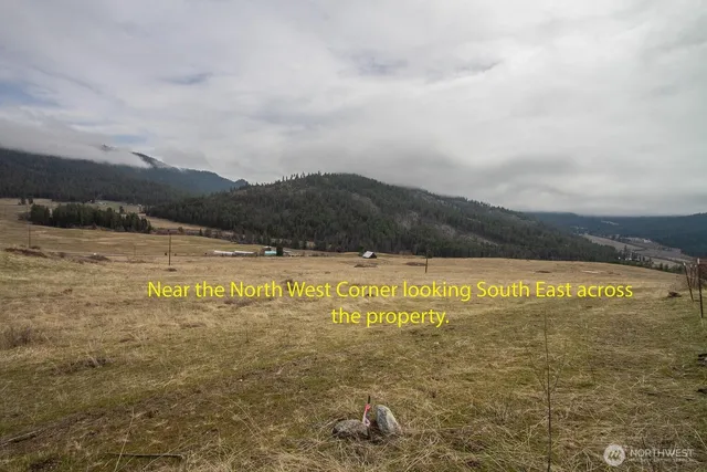 a view of a lake with houses in the back
