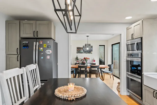 a kitchen with stainless steel appliances a stove and a microwave
