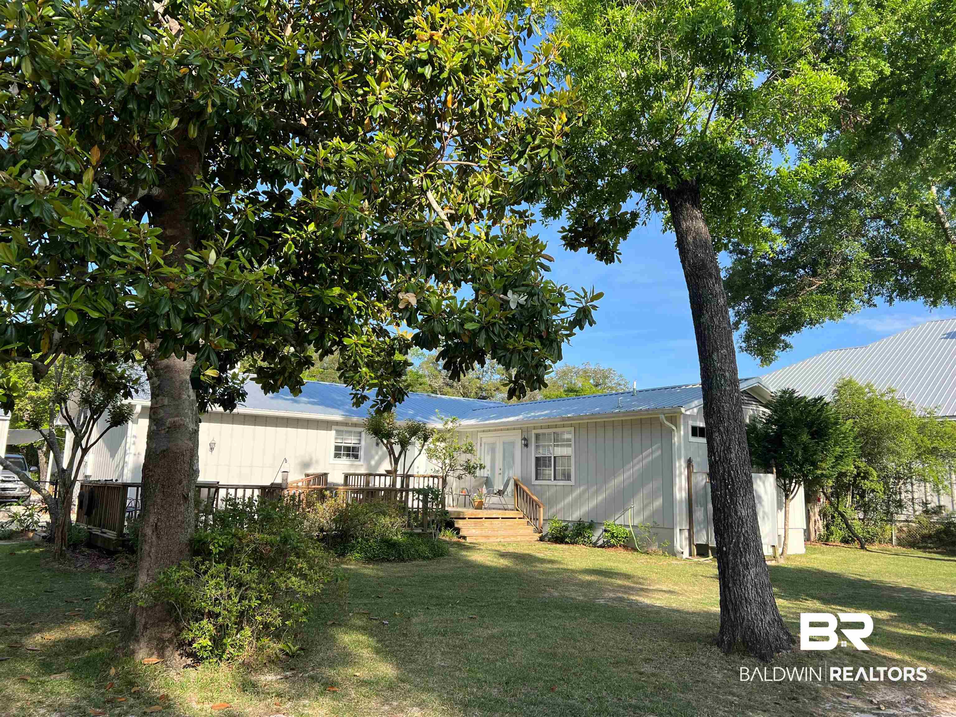 5415 Greentree Road Orange Beach, AL 36561 - Photo 42 of 55 View of grassy yard with a deck