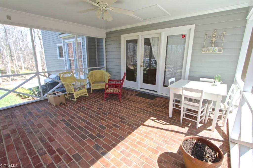 287 Yadkin Valley Road Advance, NC 27006 - Photo 18 of 20 Oversized screen porch with brick floor.