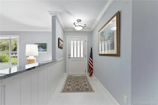 a kitchen with stainless steel appliances granite countertop a refrigerator sink and cabinets