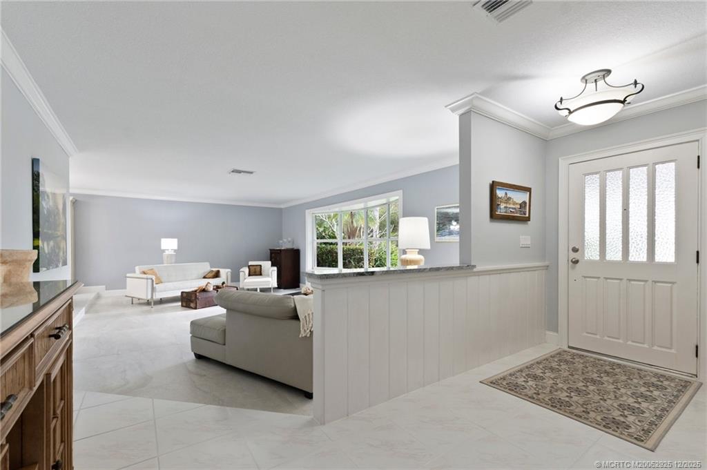 20 Banyan Road Stuart, FL 34996 - Photo 14 of 95 a living room with furniture and a window